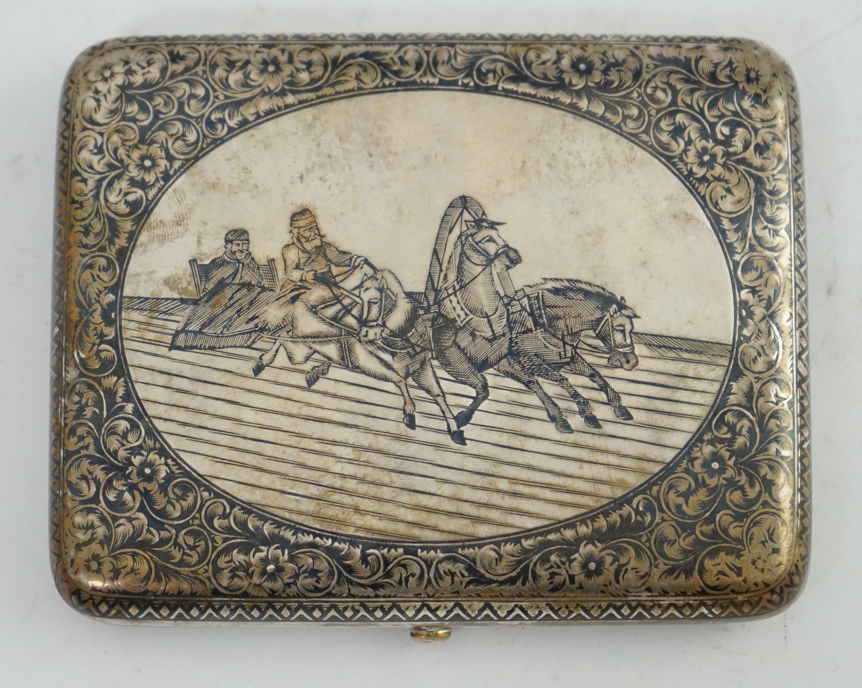 A late 19th century Russian 84 zolotnik silver and niello cigarette case